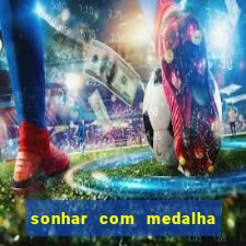 sonhar com medalha de santo